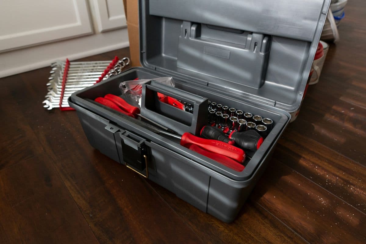 An open toolbox full of hand tools