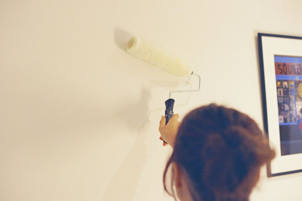 Painting a living room wall with a roller